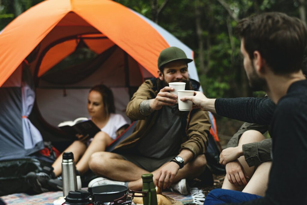 Friends camping in the forest together